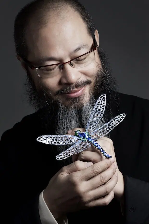 Self-taught artist, sculptor, and jewelry innovator Wallace Chan has spent more than five decades redefining what precious materials can do. Courtesy of Wallace Chan. Portrait of Wallace Chan holding a jeweled dragonfly