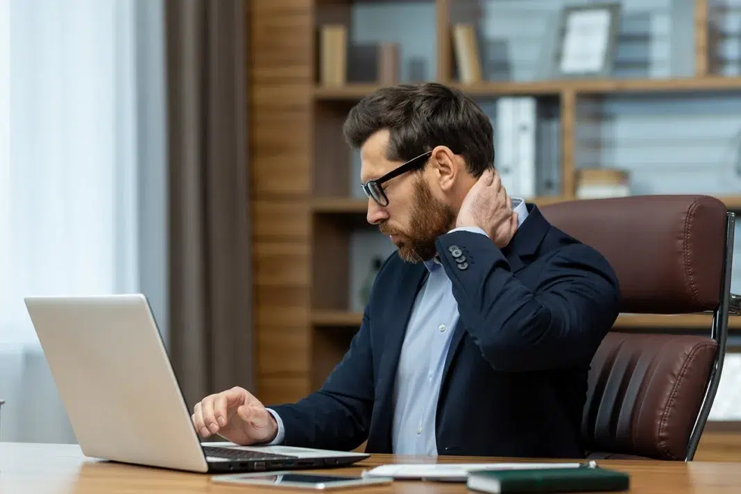 a mature business man with neck pain. Vecteezy-medium a mature business man with neck pain. Vecteezy-medium