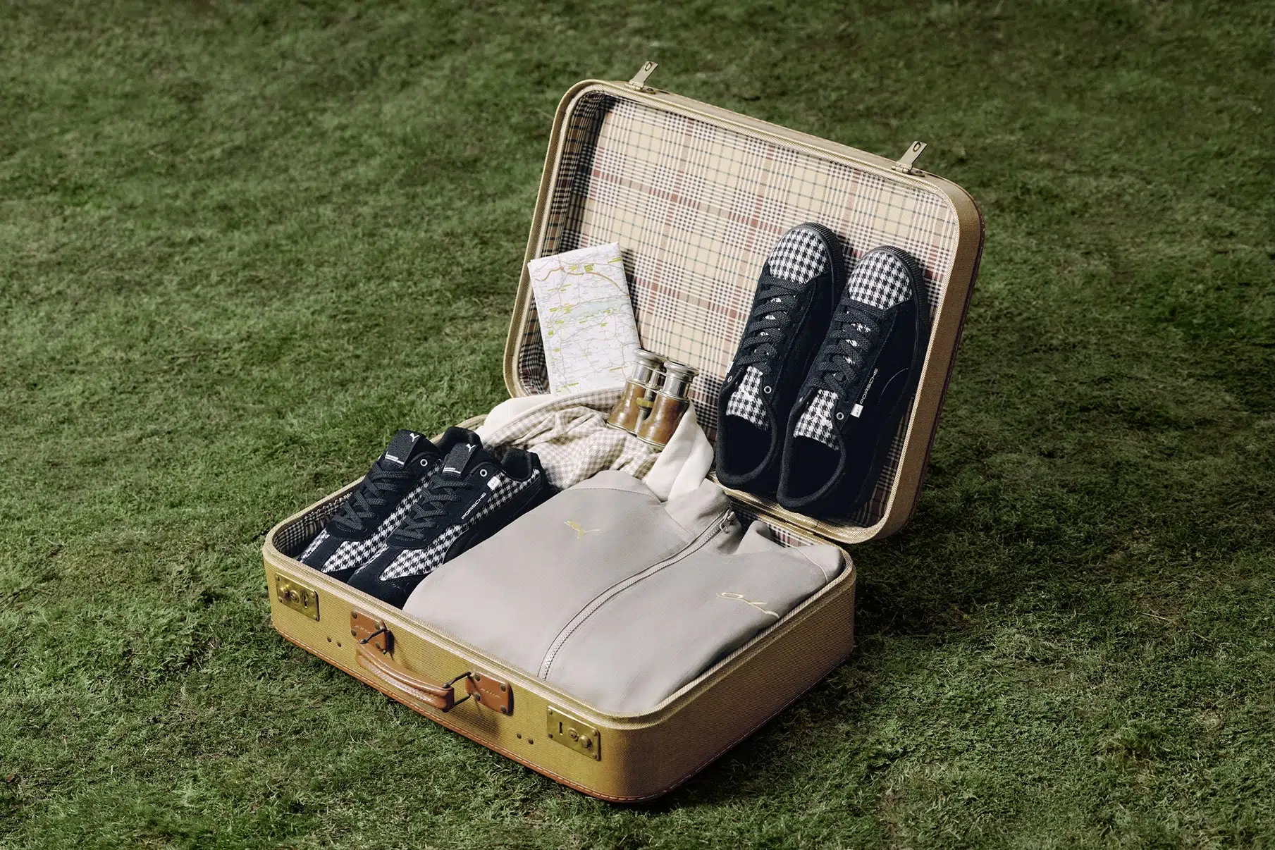 The Fall/Winter 2026 collection brings Porsche’s Pepita motif into a curated mix of sneakers and ready-to-wear pieces with a strong sense of travel and nostalgia. The Fall/Winter 2026 collection brings Porsche’s Pepita motif into a curated mix of sneakers and ready-to-wear pieces with a strong sense of travel and nostalgia.