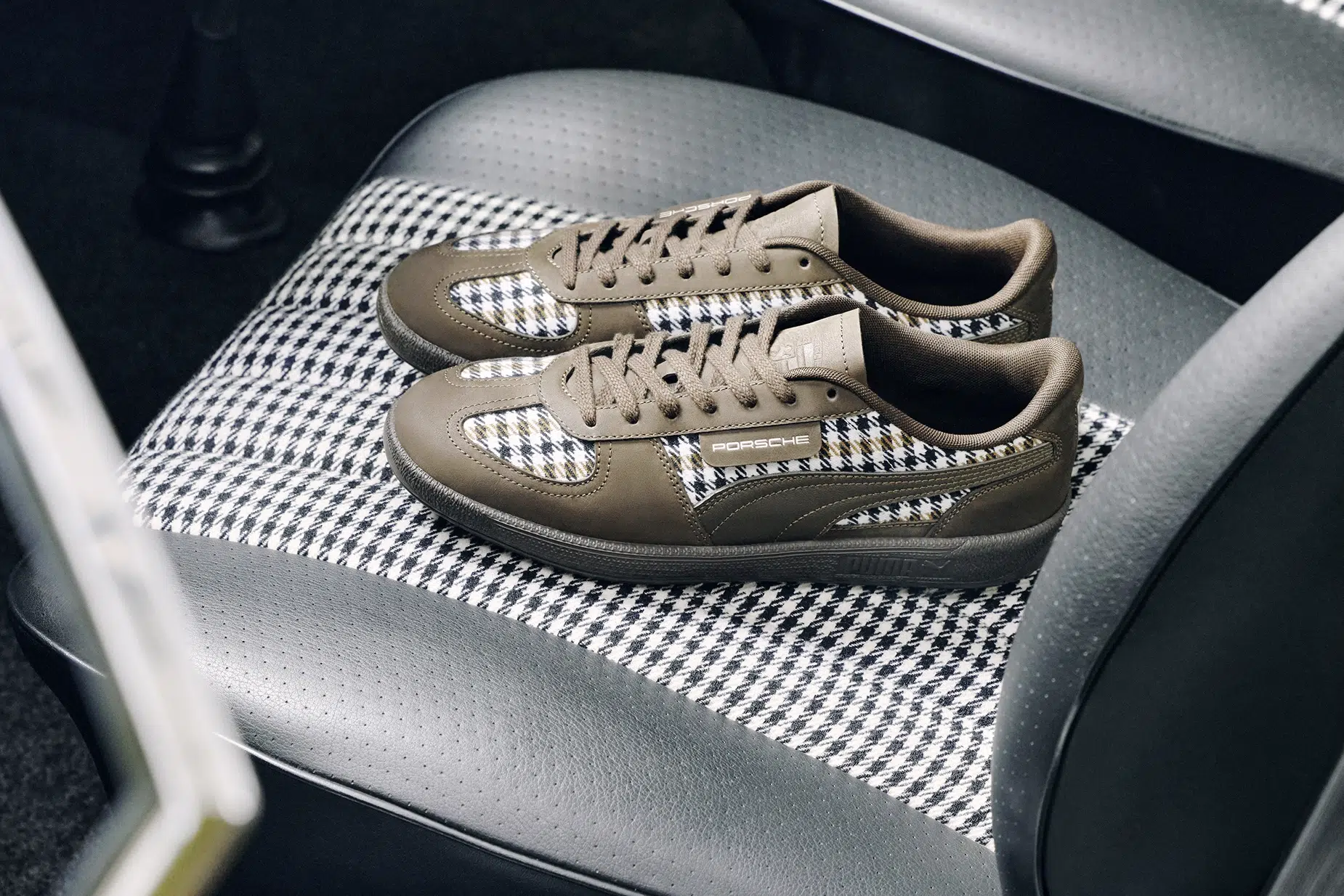 PUMA x Porsche extends the Pepita story beyond the cockpit, pairing heritage-inspired footwear with a distinctly automotive lifestyle aesthetic. PUMA x Porsche extends the Pepita story beyond the cockpit, pairing heritage-inspired footwear with a distinctly automotive lifestyle aesthetic.