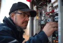 How an Electrician Can Make Your Home Safer An Electrician making your home safer. Vecteezy-medium