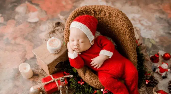 Comfort and Connection During the Holidays: The Appeal of Family Christmas Pajamas Baby wearing Christmas Pajamas. Photo by Tu Nguyen from pixaby