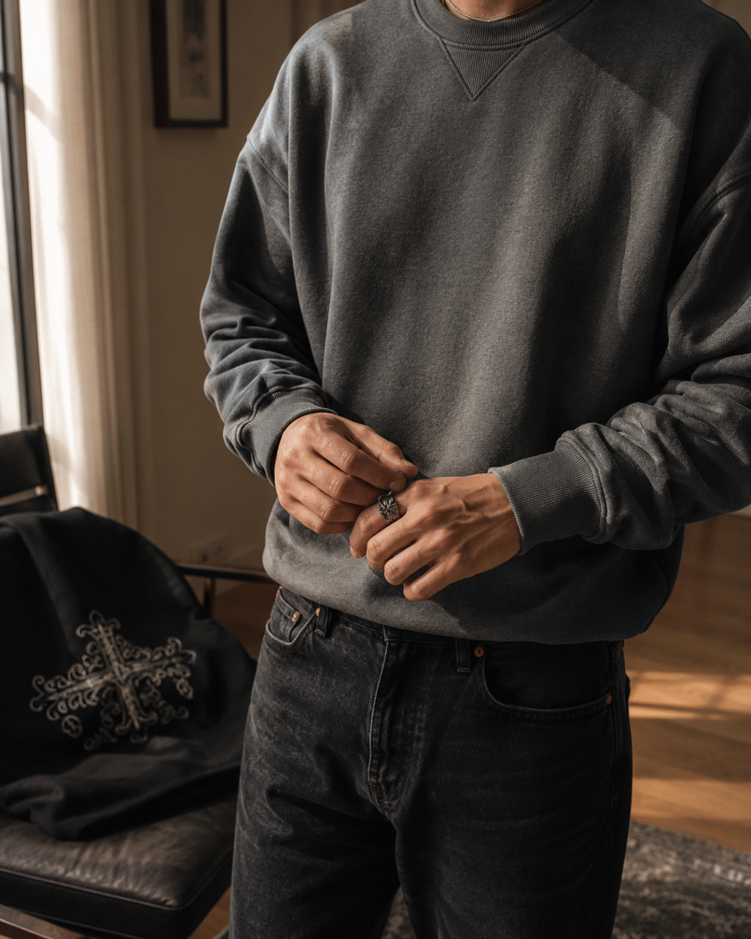 Capsule Wardrobe Image by ChatGPT Image Aug 9, 2026, 07_01_23 PM Neatly folded Chrome Hearts hoodie beside plain tees and jeans in a small capsule wardrobe