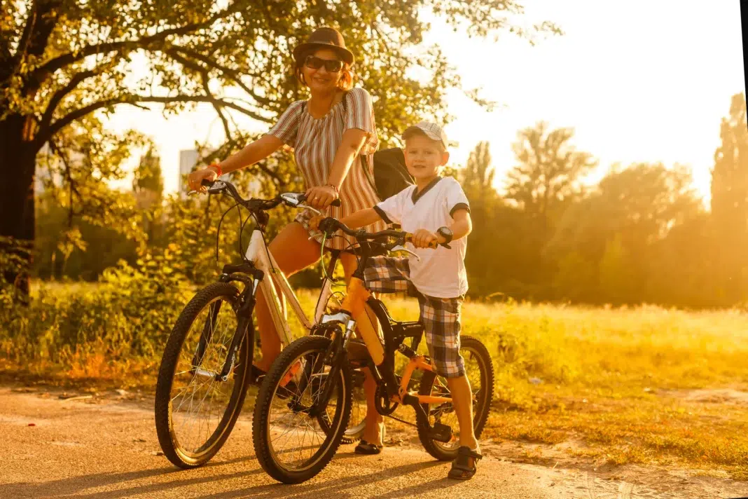 Mom and son riding on electric bikes. Vecteezy-medium Mom and son riding on electric bikes. Vecteezy-medium