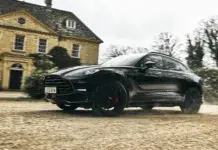 Aston Martin DBX Brings British Power to Mobland Aston Martin DBX driving outside a country estate in MobLand Season 2