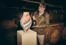 Glenmorangie’s Oldest Whisky Yet Is 50 Years in the Making Dr. Bill Lumsden with Glenmorangie 50 Years Old and porcelain presentation vessel