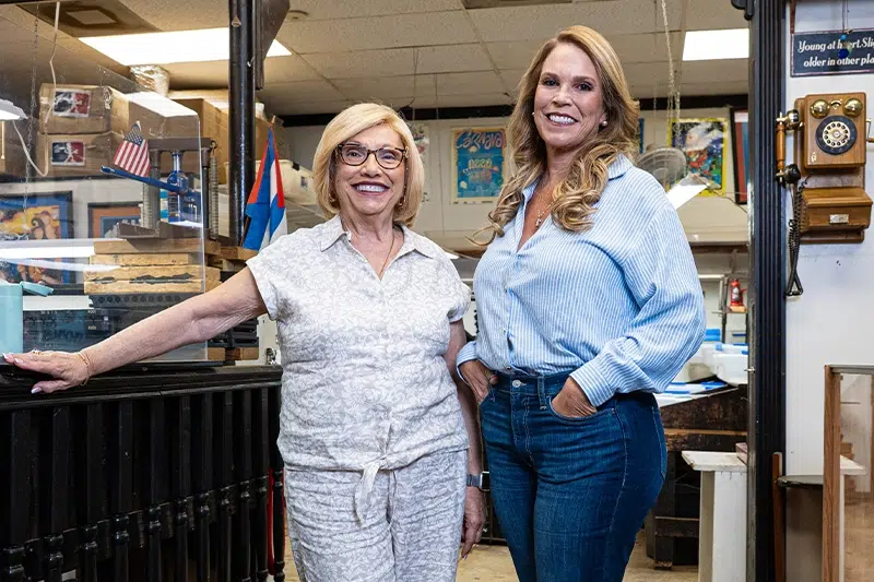 Sandy Cobas and Giselle Herrera in a cigar factory