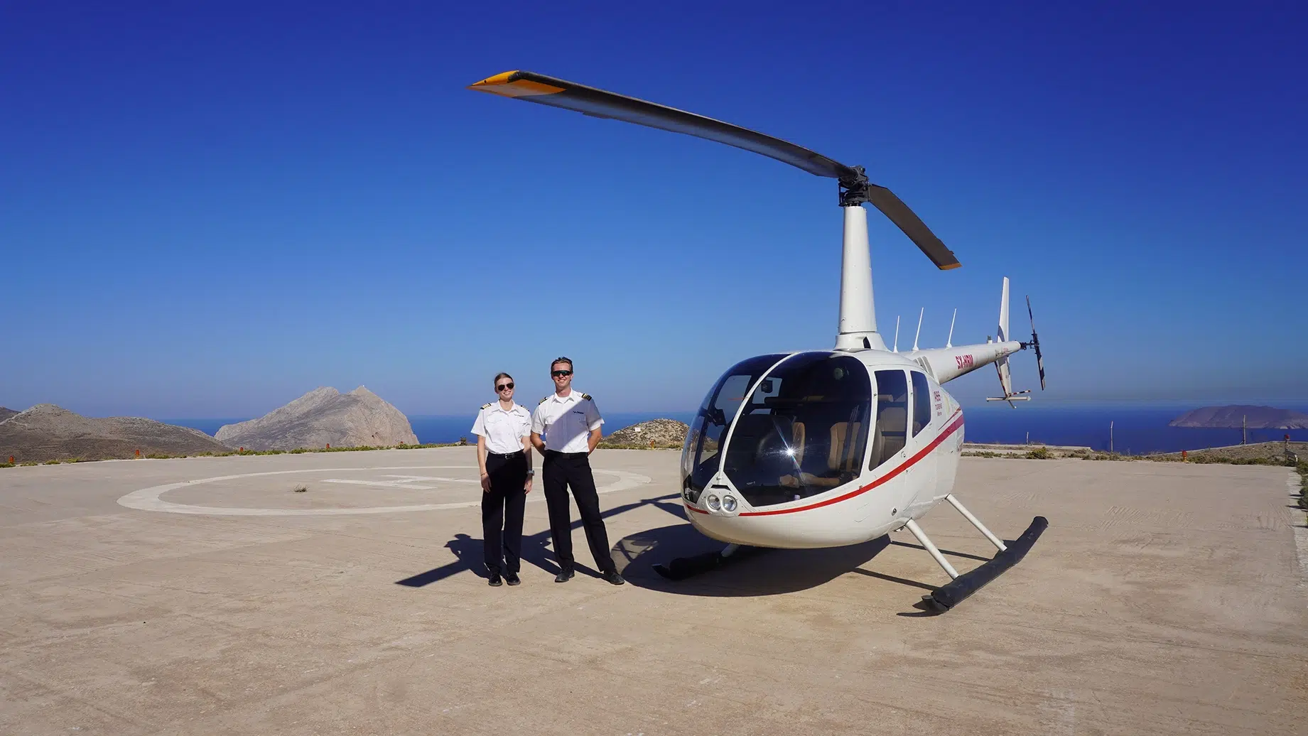 Hoper helicopter and crew at a Greek island heliport Hoper helicopter and crew at a Greek island heliport