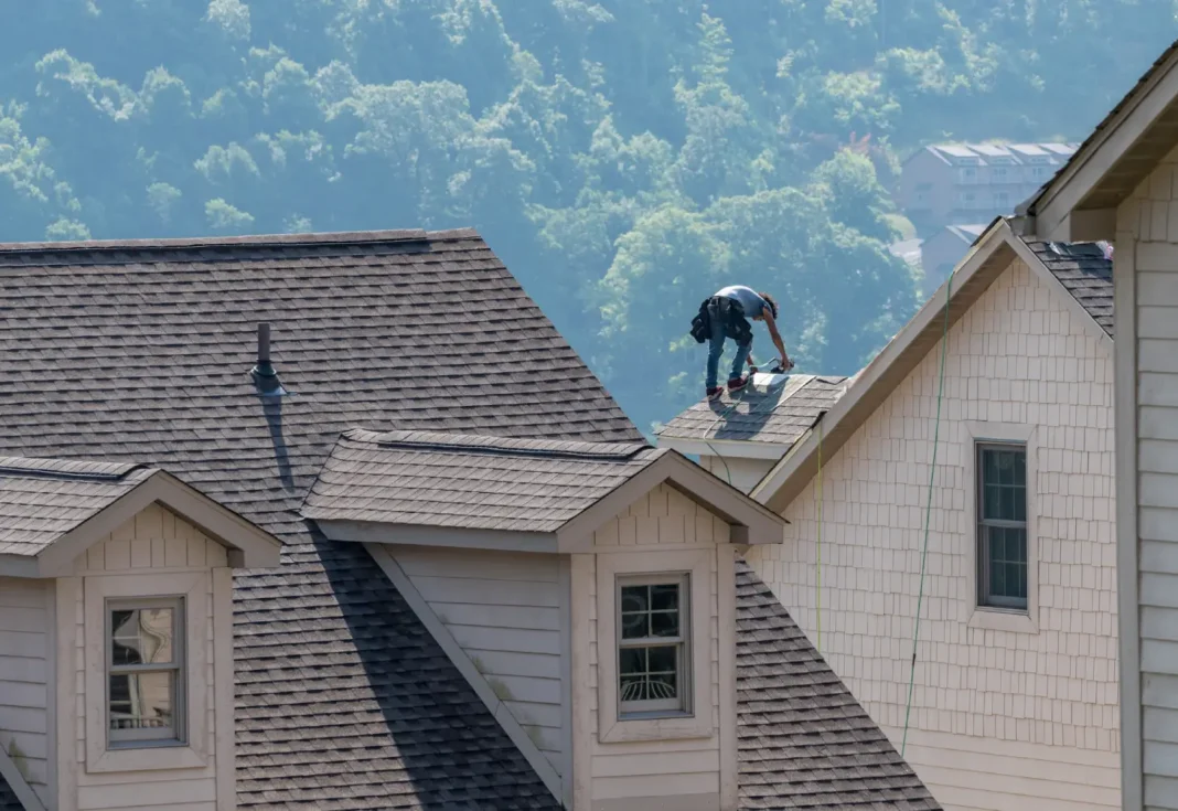 young professional roofer contractor working on a roof. Vecteezy-medium young professional roofer contractor working on a roof. Vecteezy-medium