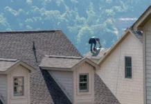 Why You Should Trust a Professional Roofer with Your Roofing Needs? young professional roofer contractor working on a roof. Vecteezy-medium